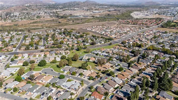 an aerial view of residential houses with outdoor space