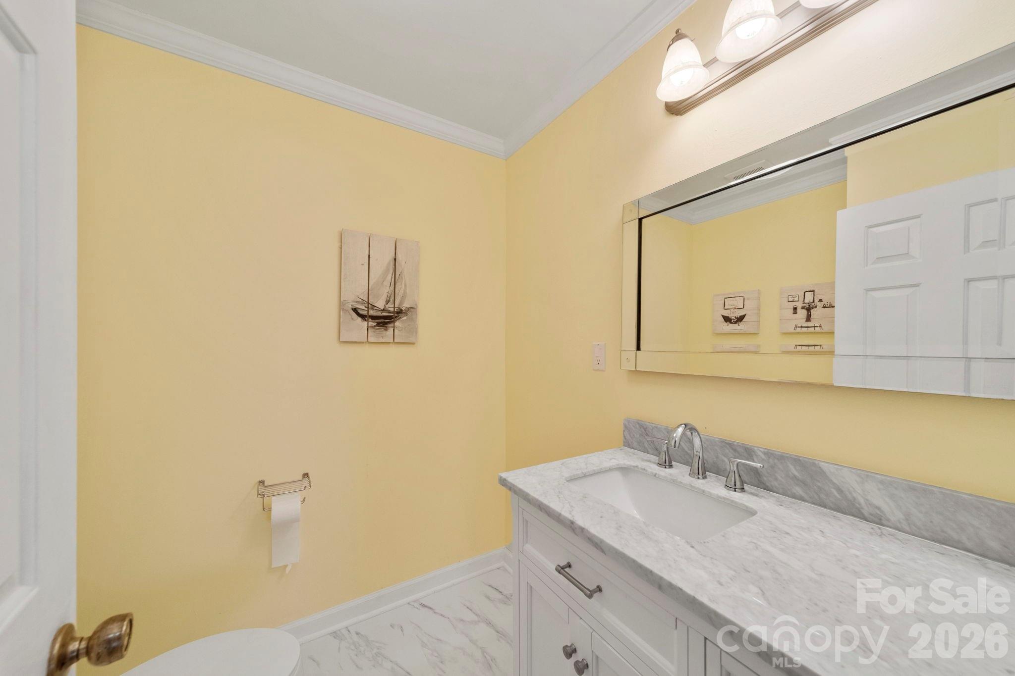 1777 Wild Turkey Road, Unit 23 Camden, SC 29020 - Photo 11 of 45 a bathroom with a granite countertop sink and a mirror