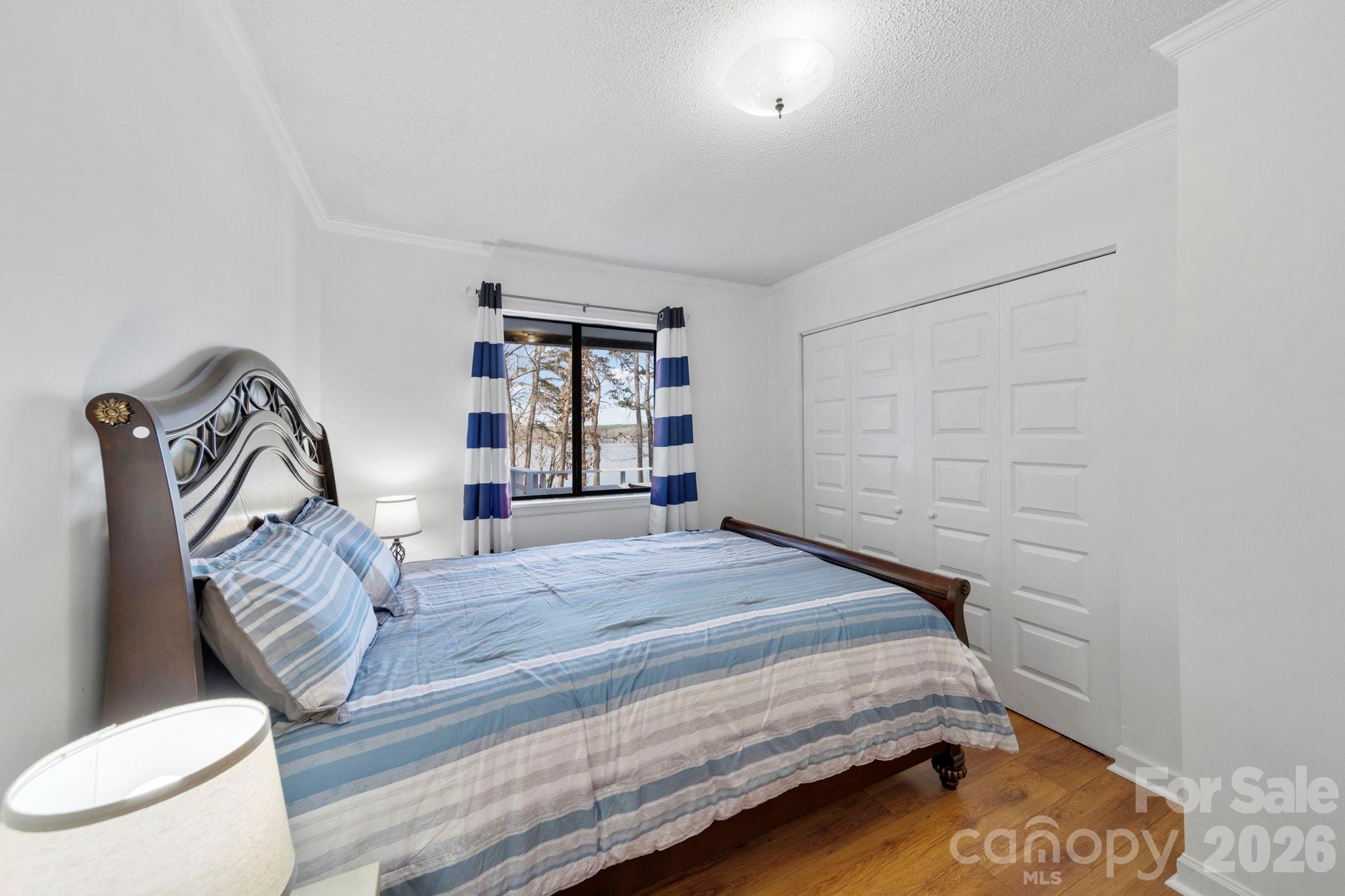 1777 Wild Turkey Road, Unit 23 Camden, SC 29020 - Photo 12 of 45 a bedroom with a bed and dresser