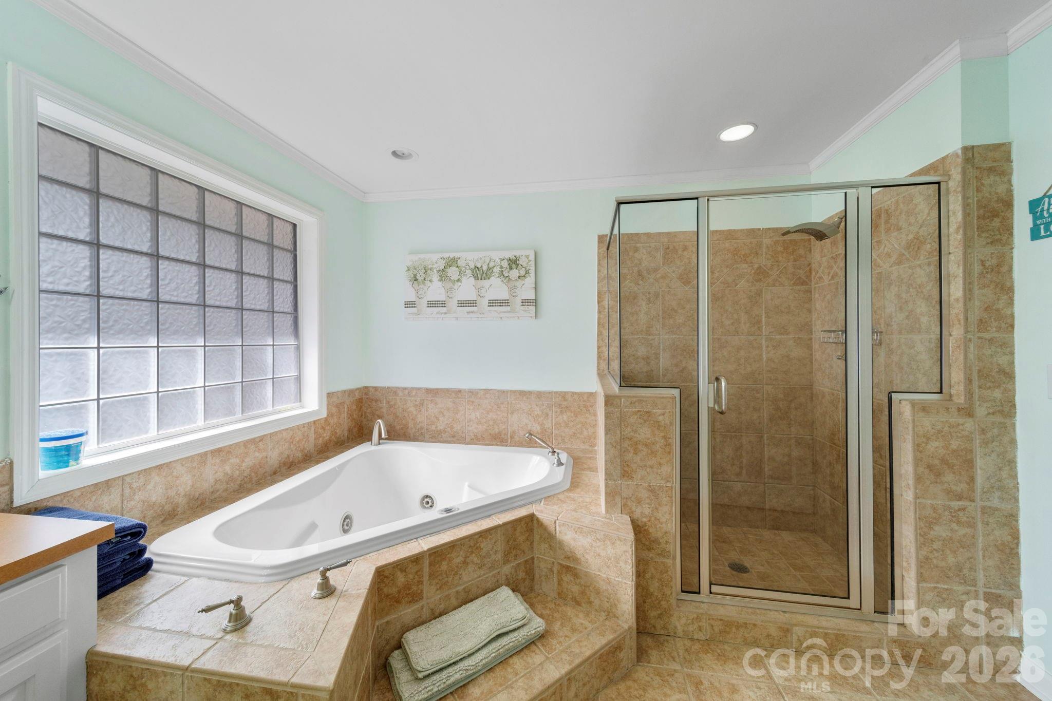 1777 Wild Turkey Road, Unit 23 Camden, SC 29020 - Photo 13 of 45 a bathroom with a tub a sink and a window