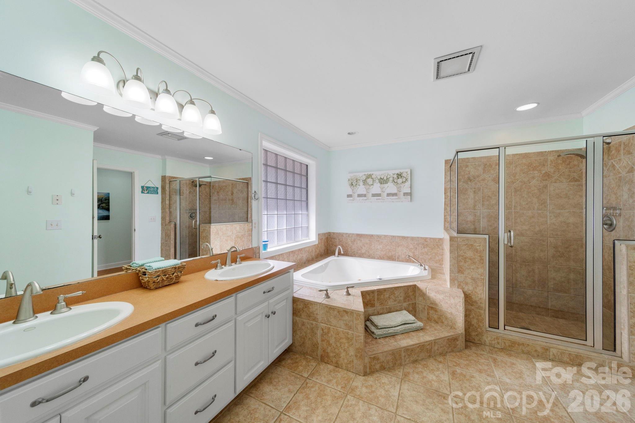 1777 Wild Turkey Road, Unit 23 Camden, SC 29020 - Photo 14 of 45 a spacious bathroom with a granite countertop sink mirror and shower