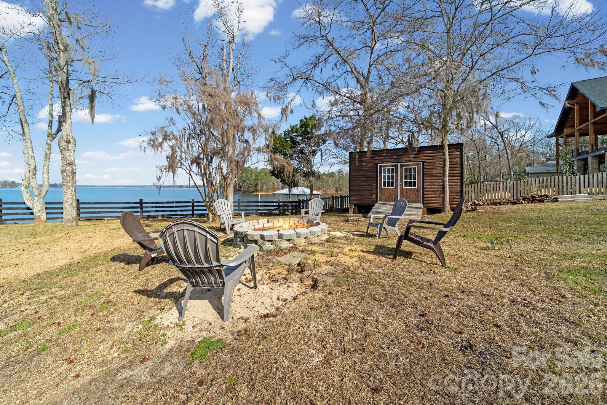 1777 Wild Turkey Road, Unit 23 Camden, SC 29020 - Photo 33 of 45 a backyard of a house with table and chairs