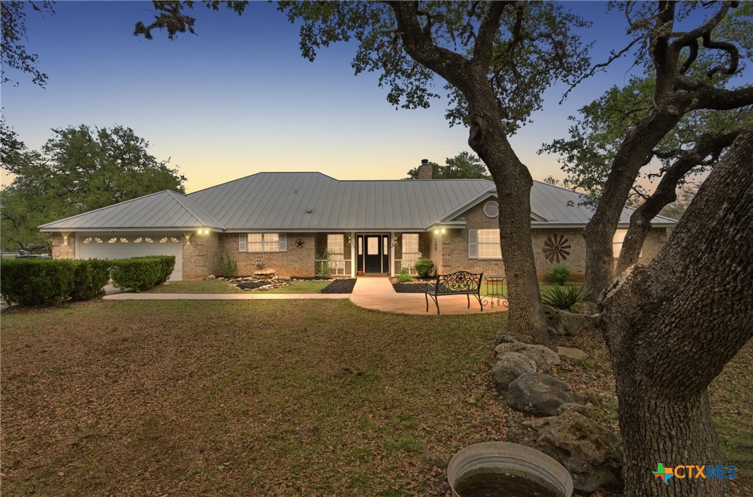 642 Phantom Rider Trail Spring Branch, TX 78070 - Photo 2 of 41 a view of a house with backyard and sitting area