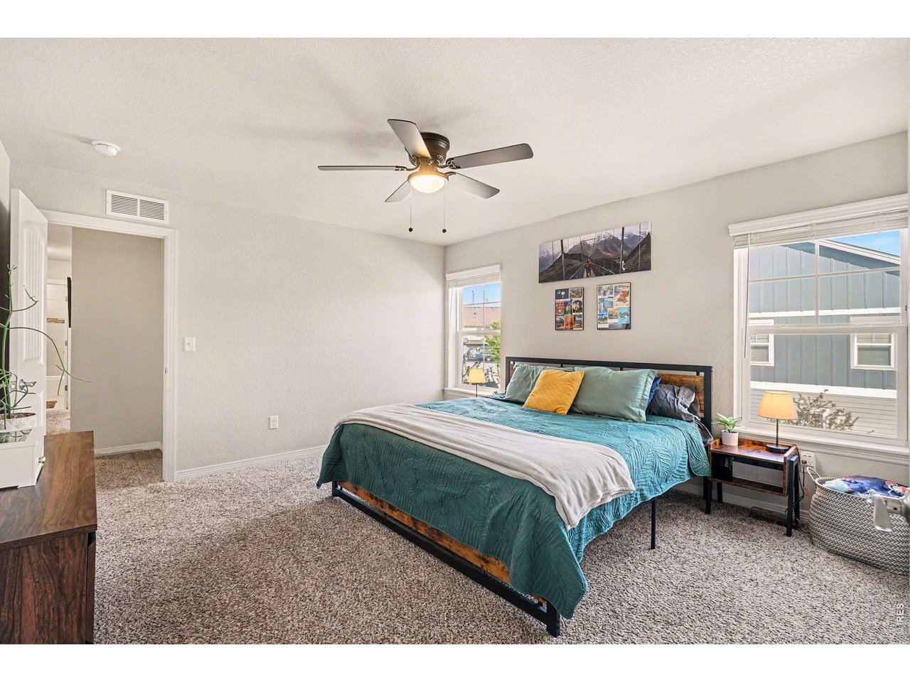 107 South 8th Street Berthoud, CO 80513 - Photo 11 of 22 a bedroom with a bed dresser and a window