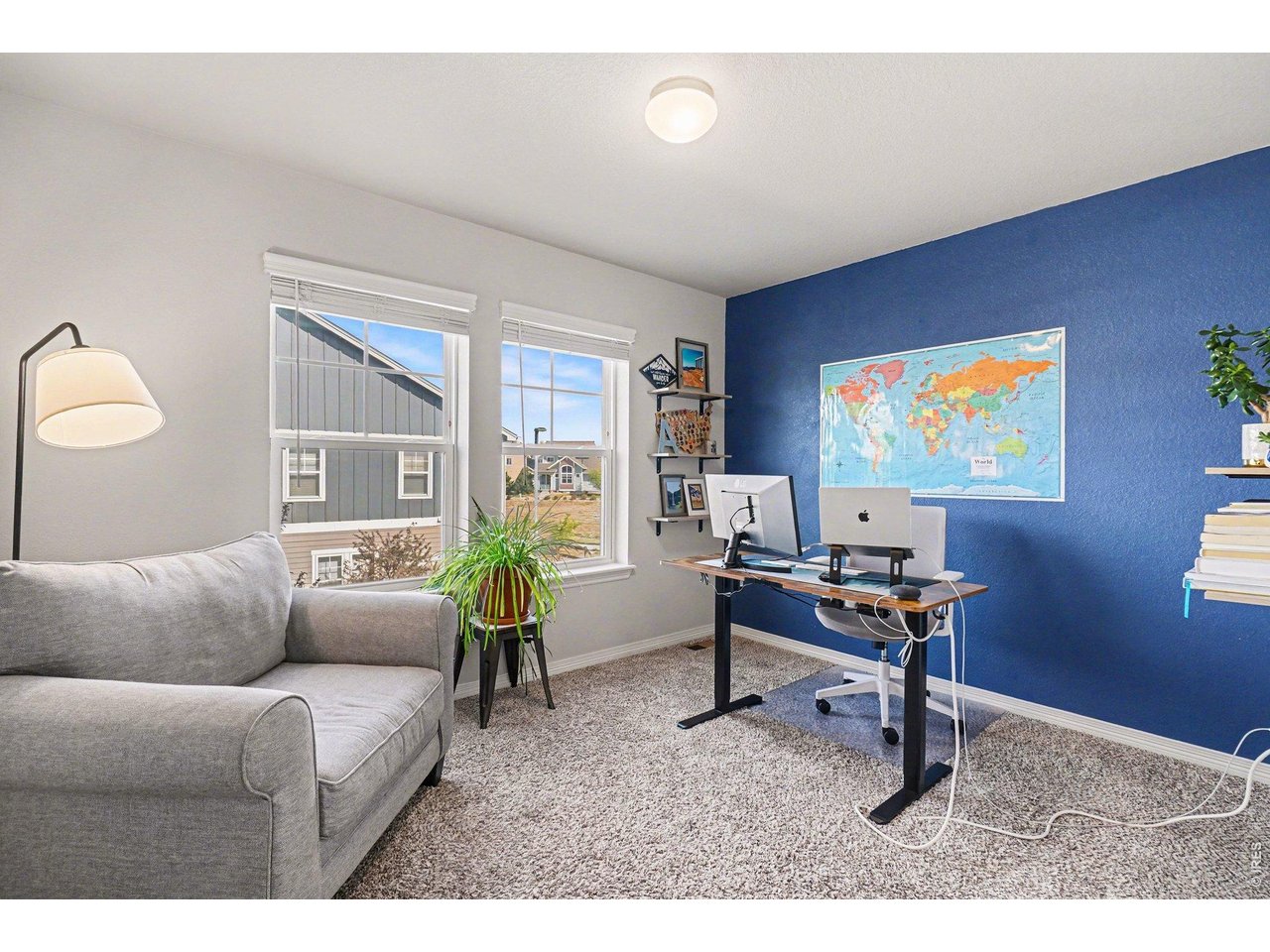 107 South 8th Street Berthoud, CO 80513 - Photo 13 of 22 a living room with furniture a rug and a window