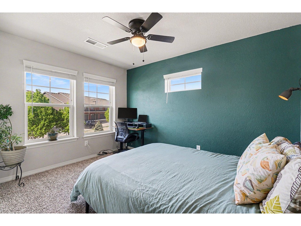 107 South 8th Street Berthoud, CO 80513 - Photo 14 of 22 a bedroom with a bed and a window