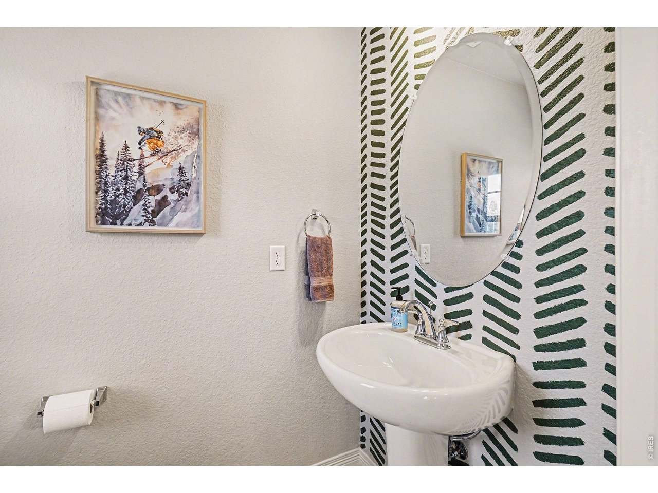 107 South 8th Street Berthoud, CO 80513 - Photo 15 of 22 a bathroom with a sink and a mirror