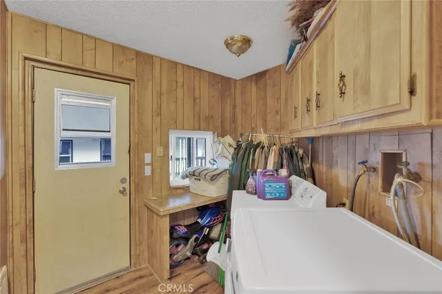 a kitchen with a refrigerator and table
