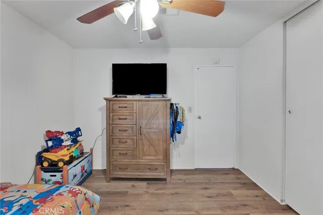 a children room with toys and flat screen tv