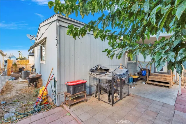 a backyard of a house with outdoor seating