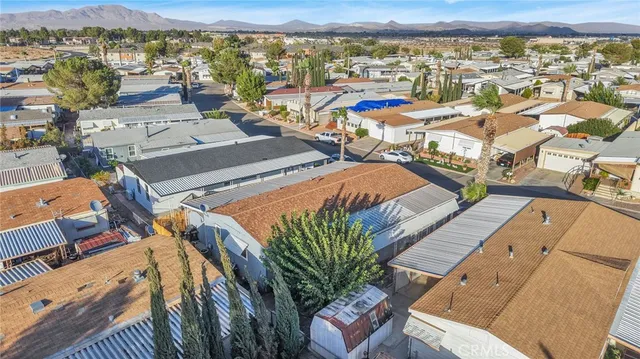 an aerial view of a house with a lake view