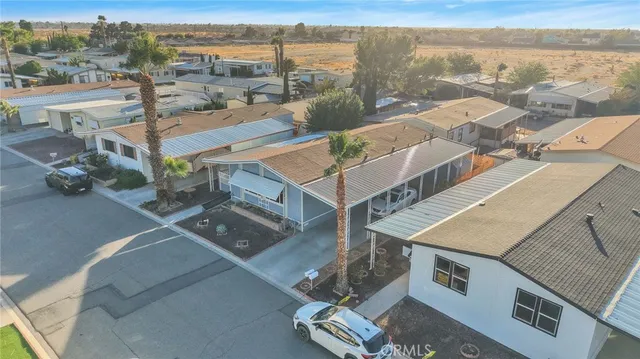 an aerial view of a house with a lake view