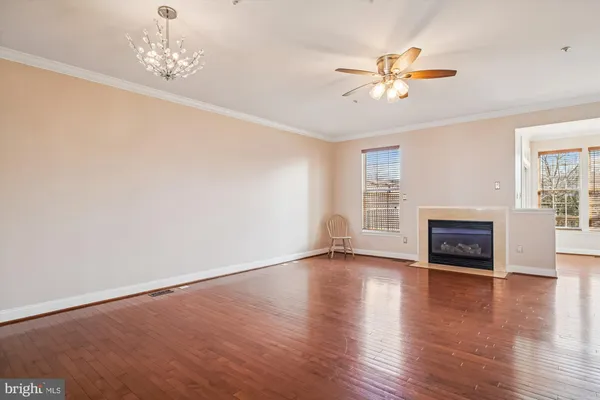 a bathroom with a granite countertop sink mirror and a bathtub