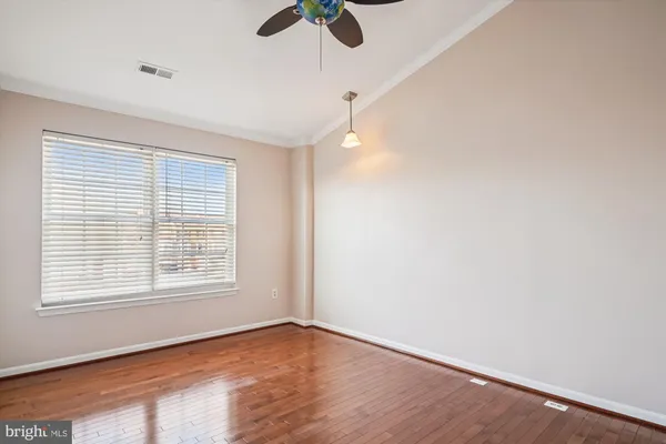 a bathroom with a granite countertop sink a toilet and a bathtub