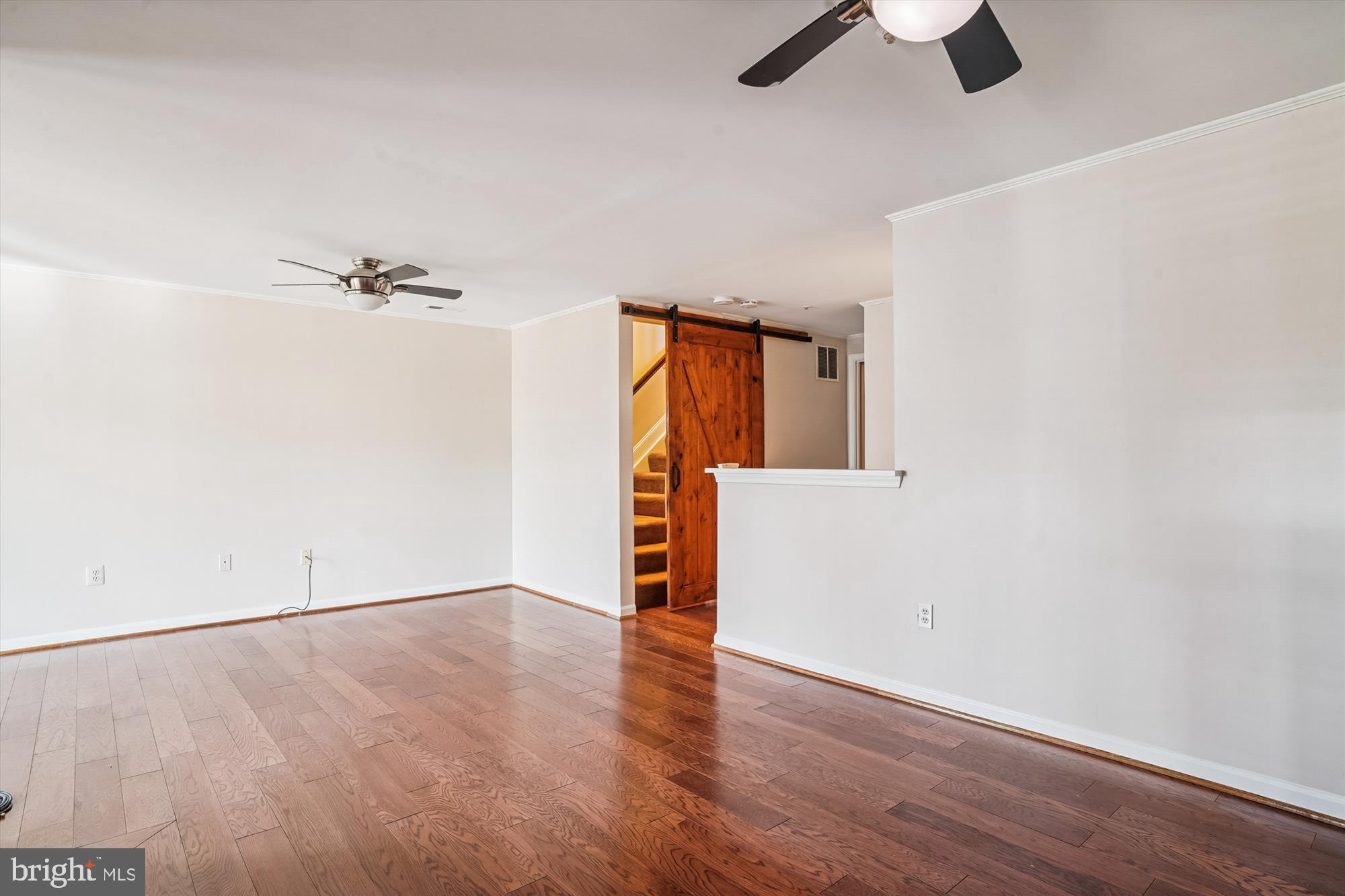 3834 Glebe Meadow Way Edgewater, MD 21037 - Photo 50 of 68 Spacious living area with warm wood accents.