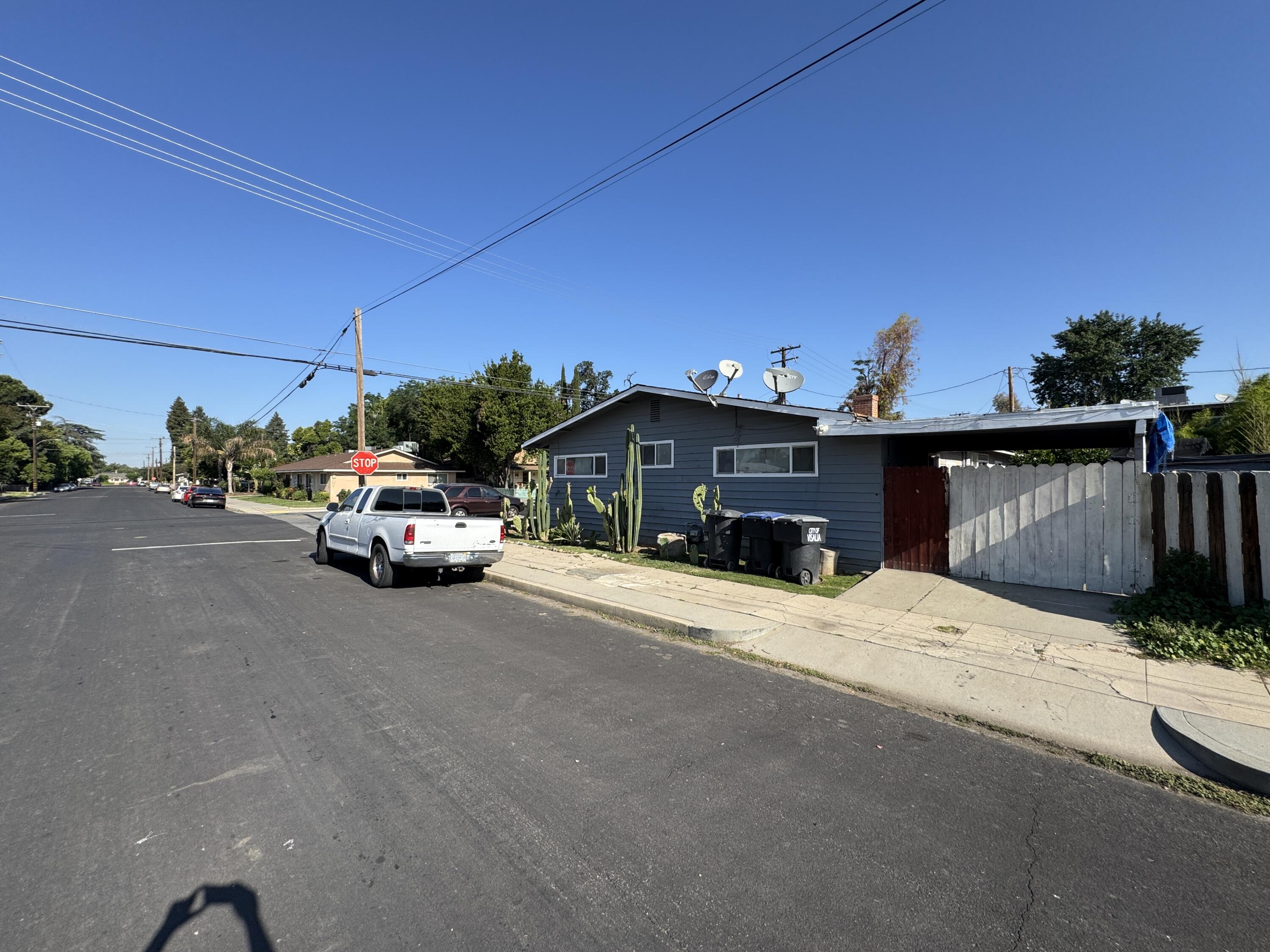 704 North Floral Street Visalia, CA 93291 - Photo 4 of 51 a car parked on the side of the road