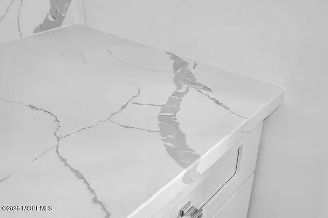 a view of staircase with white walls and white door