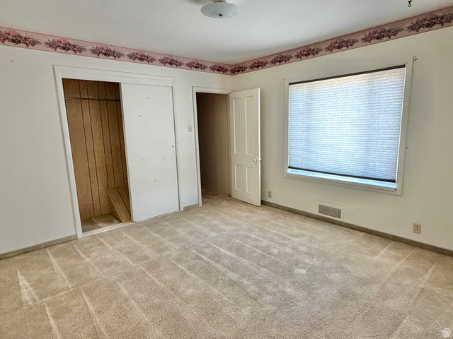 196 North 5th West Price, UT 84501 - Photo 11 of 27 Carpeted interior space with a window featuring horizontal blinds