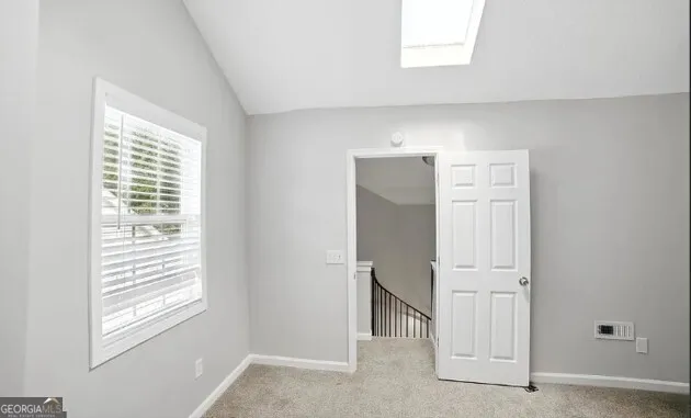 a view of an empty room with window