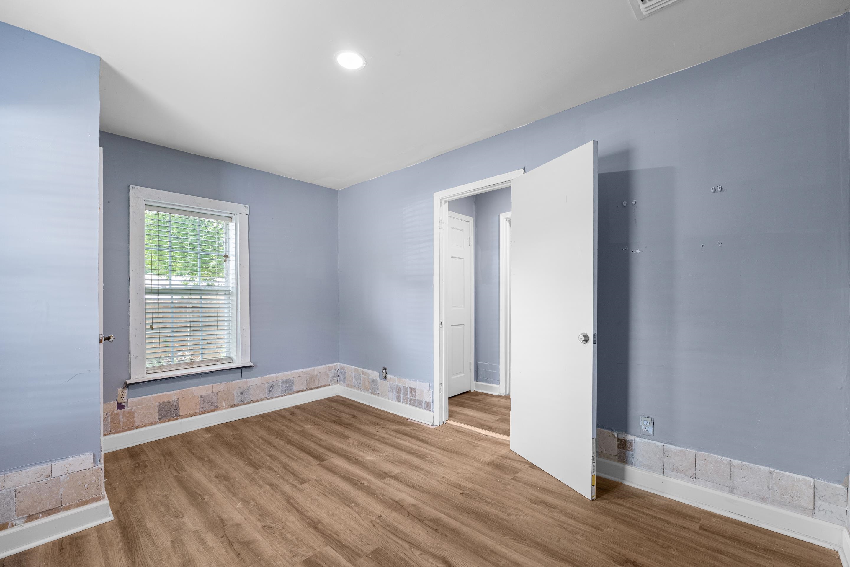 726 Harahan Road Memphis, TN 38109 - Photo 14 of 24 Spare room with wood finished floors and baseboards