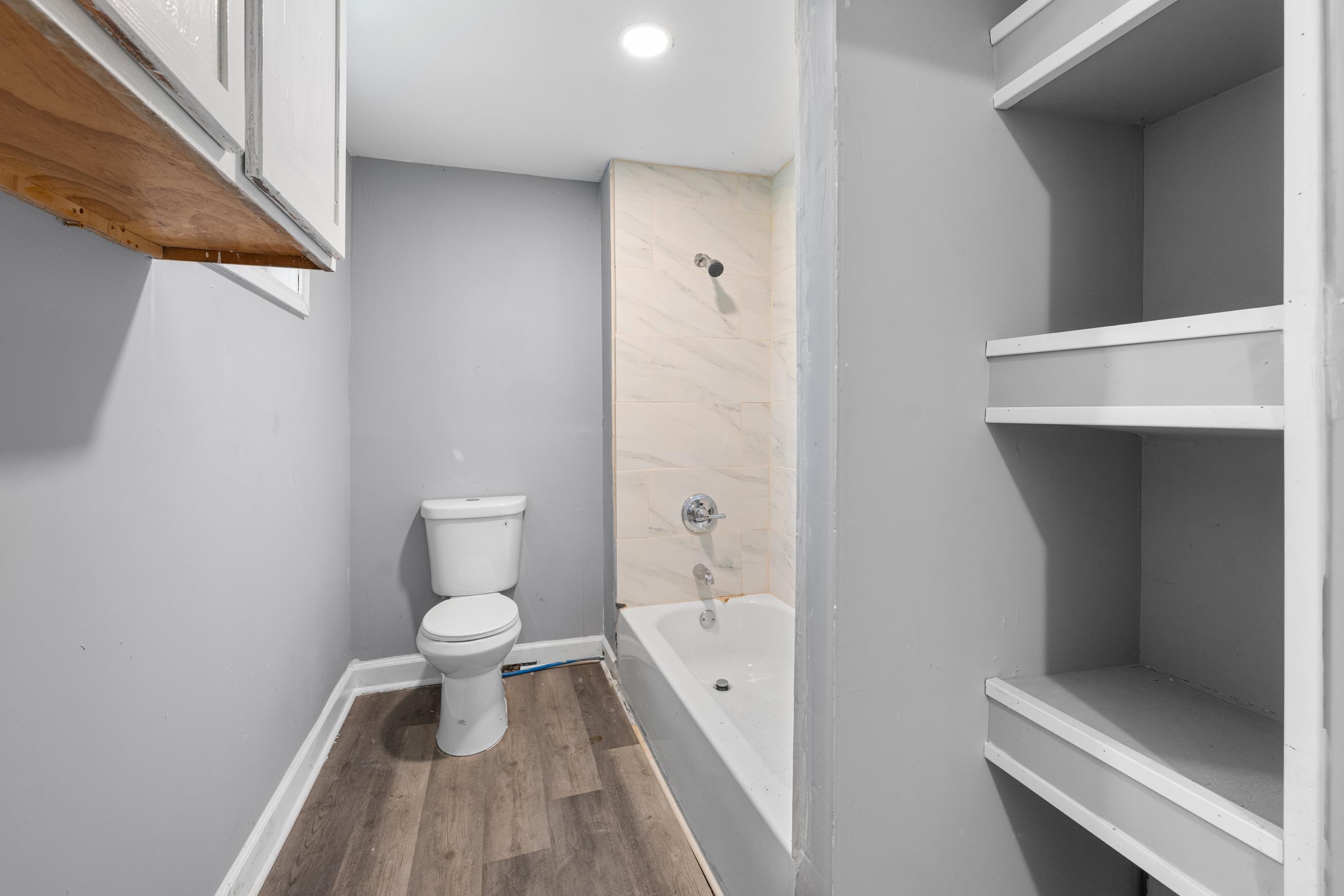 726 Harahan Road Memphis, TN 38109 - Photo 16 of 24 Bathroom with wood finished floors and shower / bathtub combination