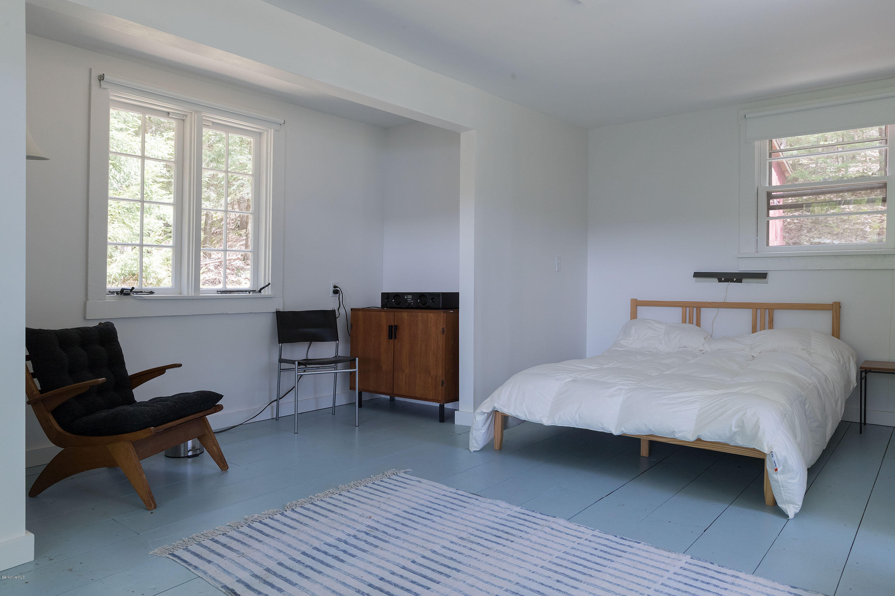 10 Tannery Road Sandisfield, MA 01255 - Photo 20 of 24 a bedroom with a bed a chair and a window