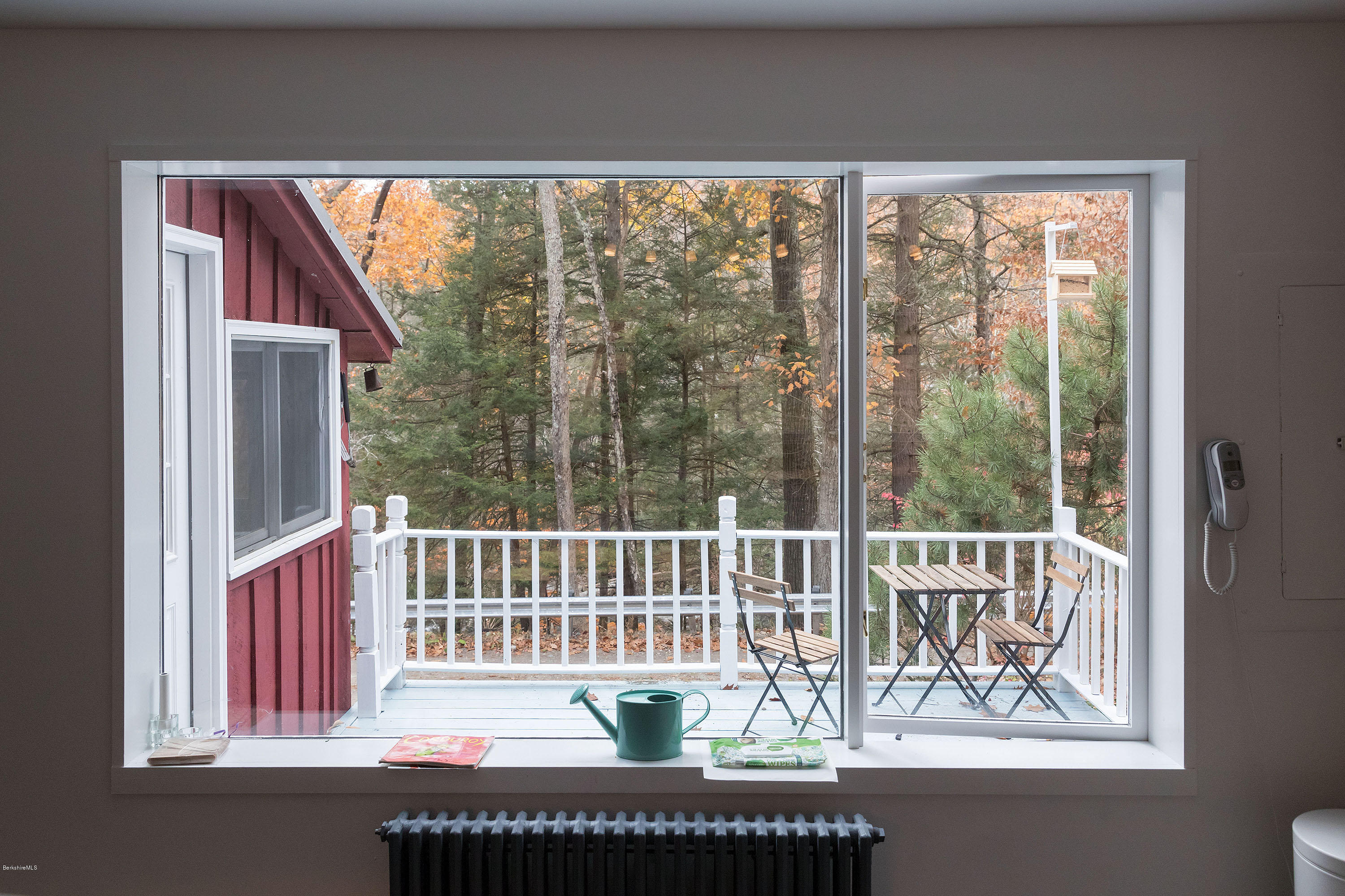10 Tannery Road Sandisfield, MA 01255 - Photo 22 of 24 a view of a balcony with chairs and wooden floor
