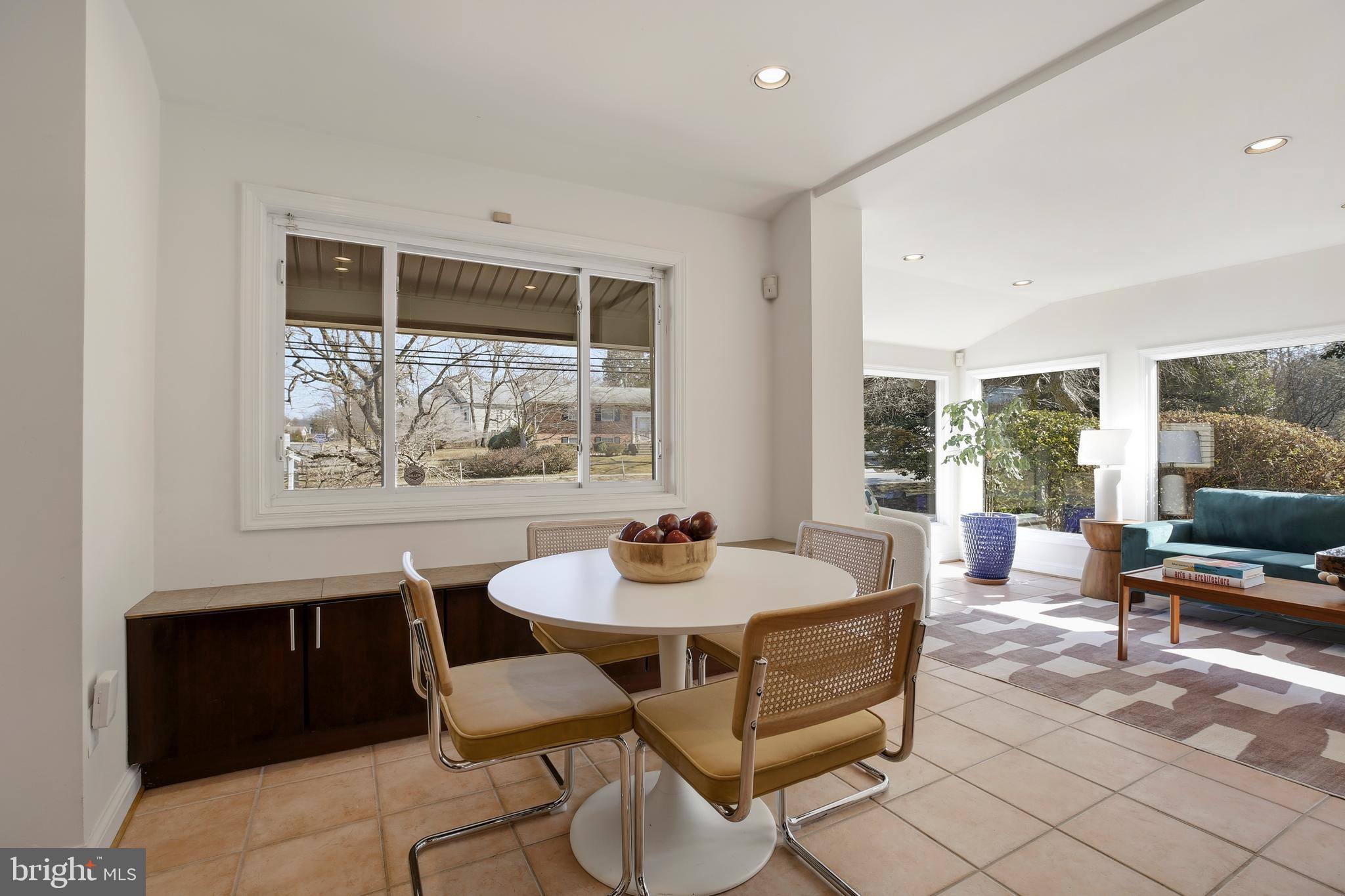 9914 Fernwood Road Bethesda, MD 20817 - Photo 18 of 61 a dining room with furniture and a window
