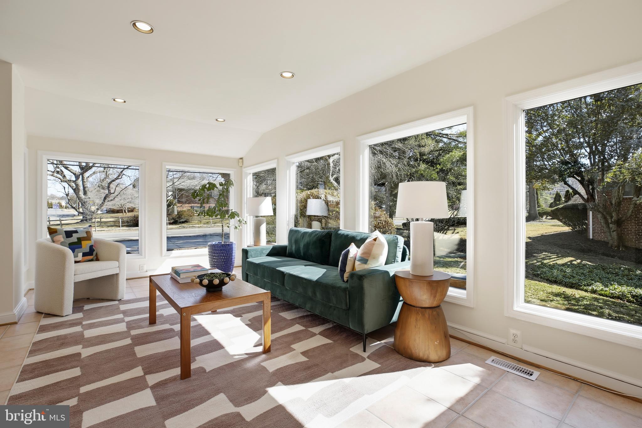 9914 Fernwood Road Bethesda, MD 20817 - Photo 20 of 61 a living room with furniture and a large window