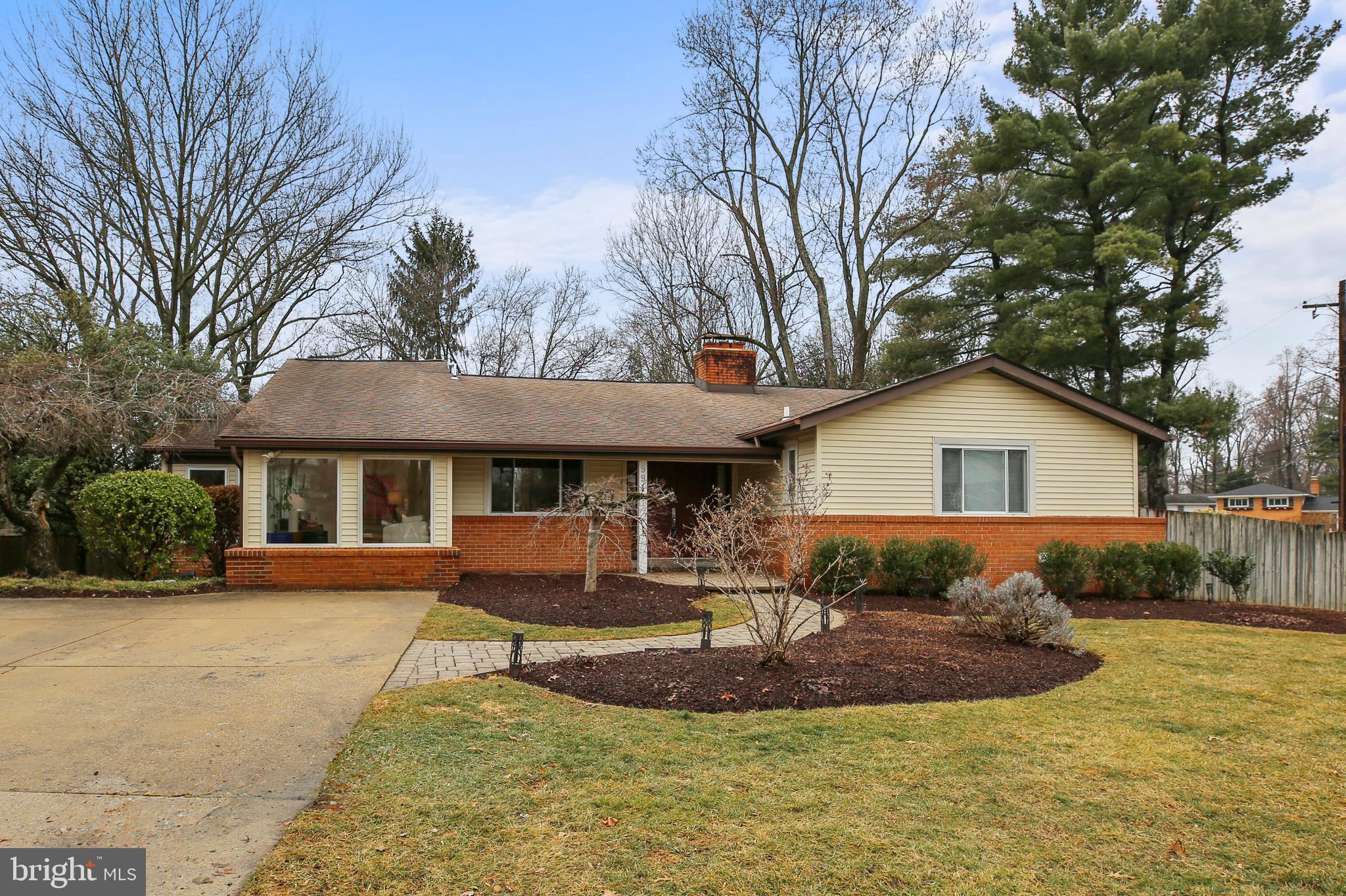 9914 Fernwood Road Bethesda, MD 20817 - Photo 2 of 61 a front view of a house with a yard