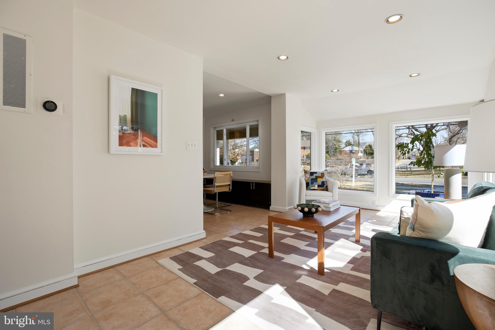 9914 Fernwood Road Bethesda, MD 20817 - Photo 21 of 61 a living room with furniture a rug and a table