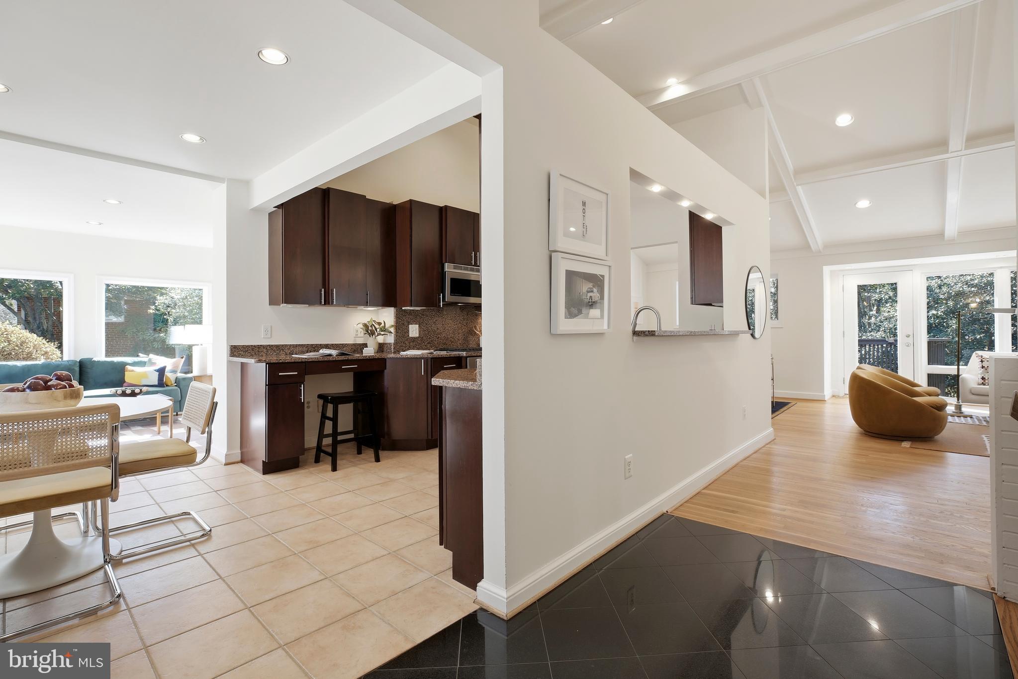 9914 Fernwood Road Bethesda, MD 20817 - Photo 23 of 61 a kitchen with stainless steel appliances a refrigerator and a stove top oven