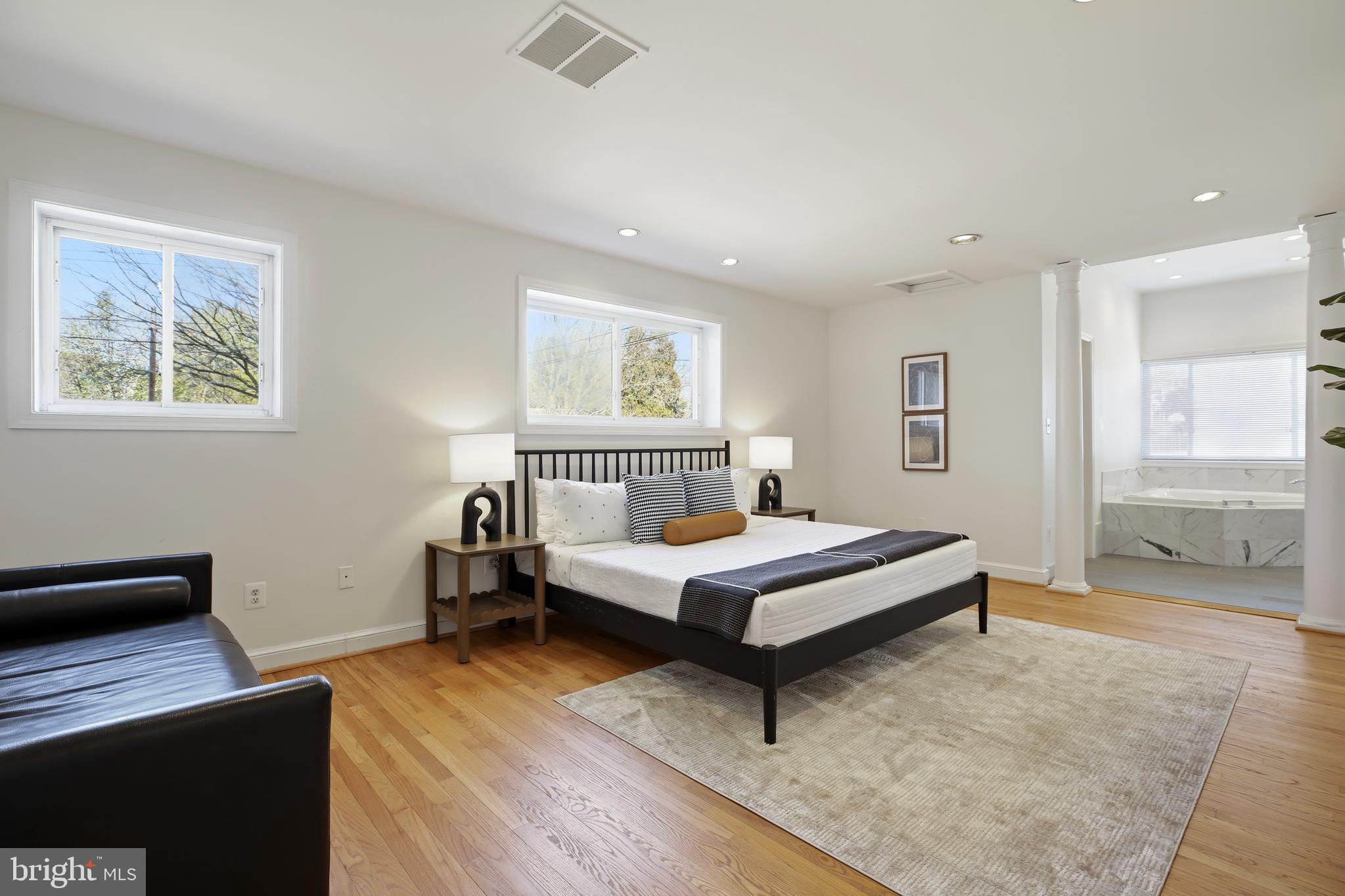 9914 Fernwood Road Bethesda, MD 20817 - Photo 26 of 61 a spacious bedroom with a bed and a desk