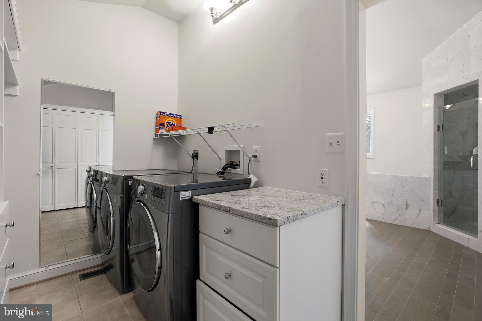 9914 Fernwood Road Bethesda, MD 20817 - Photo 29 of 61 a utility room with dryer and washer