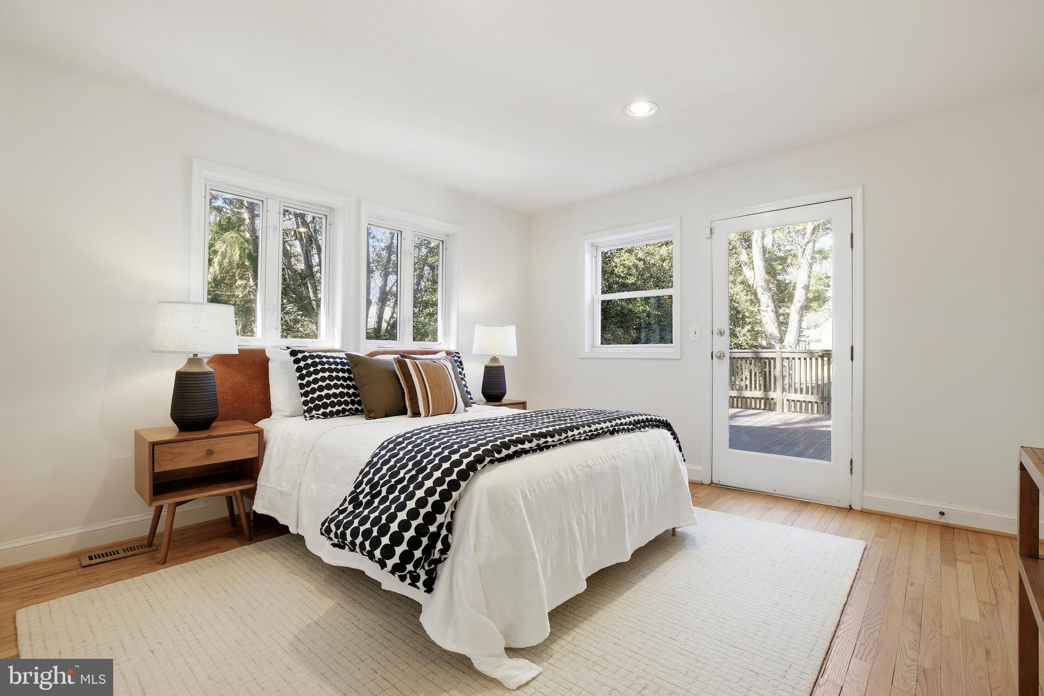 9914 Fernwood Road Bethesda, MD 20817 - Photo 32 of 61 a bed room with a bed and a chair