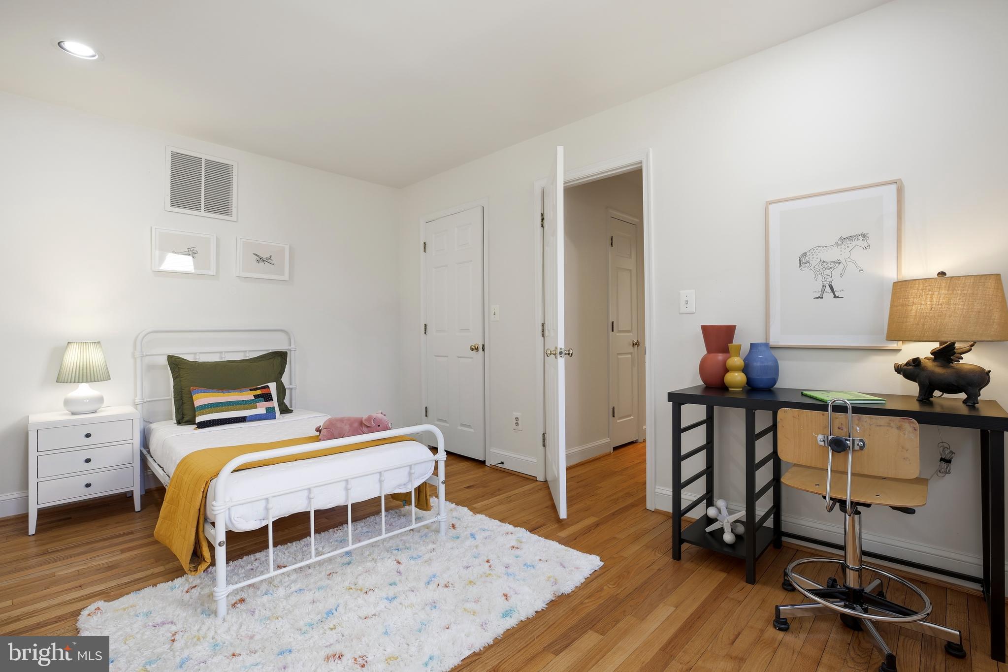 9914 Fernwood Road Bethesda, MD 20817 - Photo 35 of 61 a bedroom with a bed and a desk in it