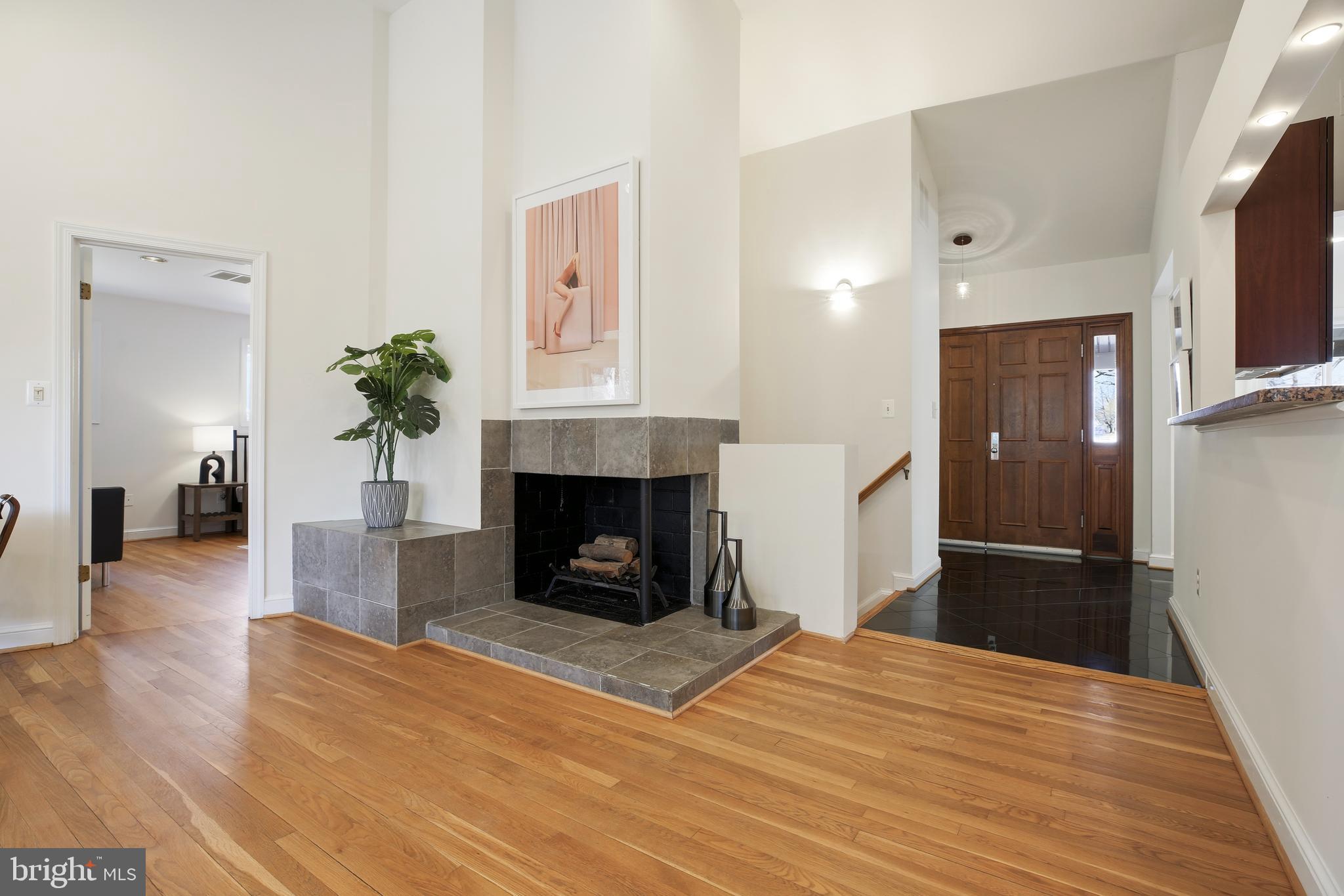 9914 Fernwood Road Bethesda, MD 20817 - Photo 38 of 61 a bedroom with a bed and a fireplace