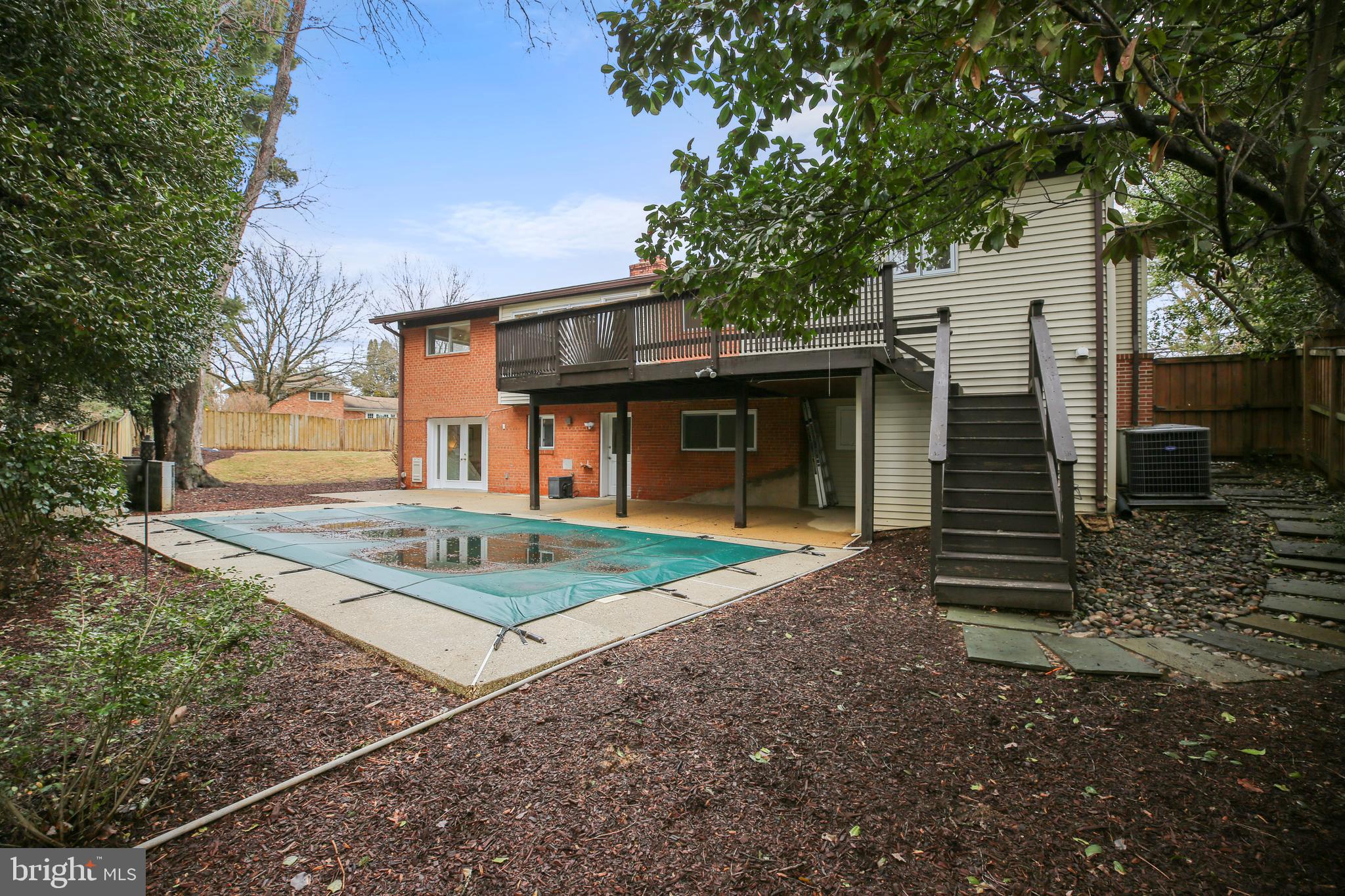9914 Fernwood Road Bethesda, MD 20817 - Photo 43 of 61 a front view of a house with garden