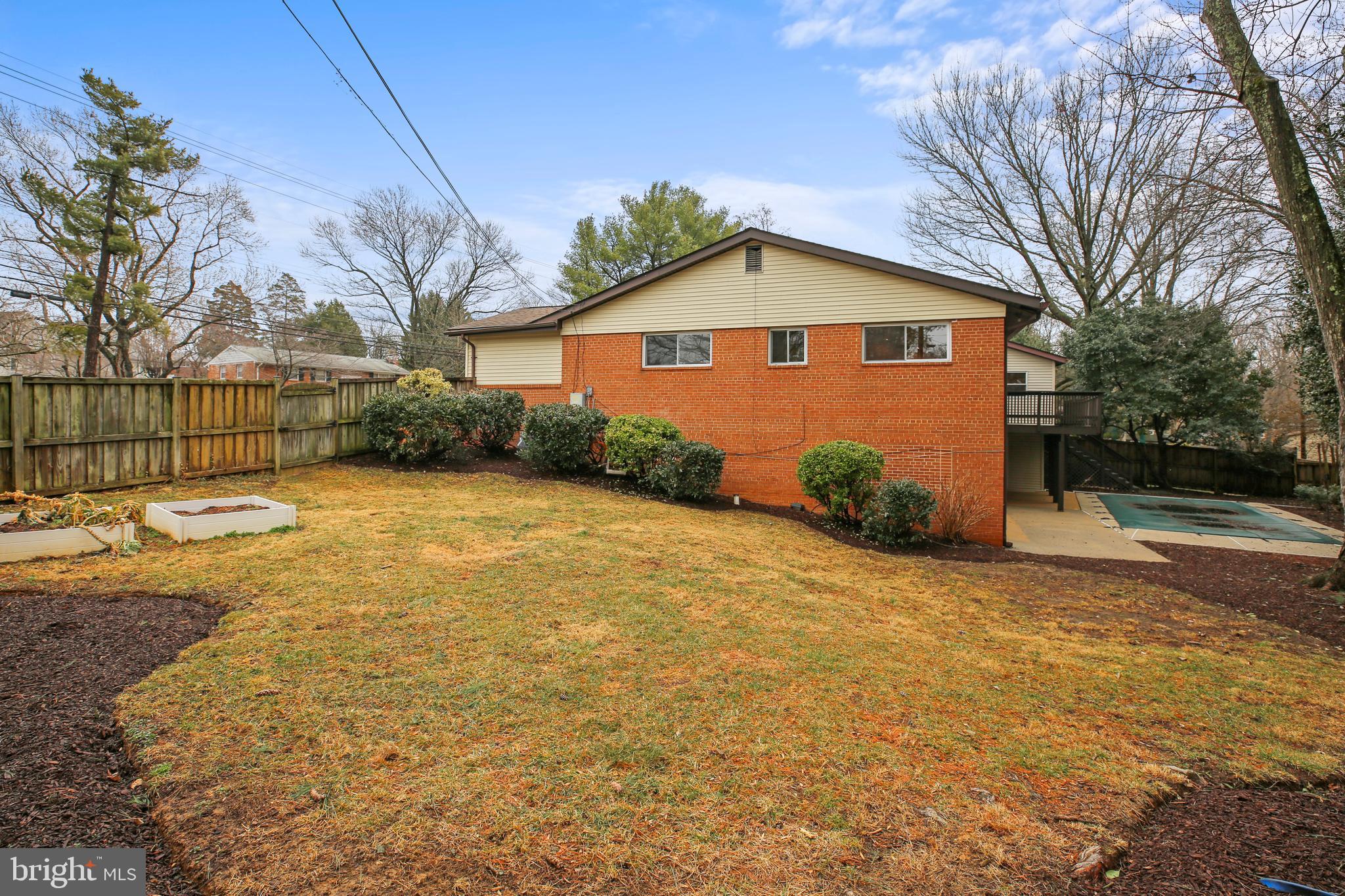 9914 Fernwood Road Bethesda, MD 20817 - Photo 44 of 61 a view of a backyard of the house