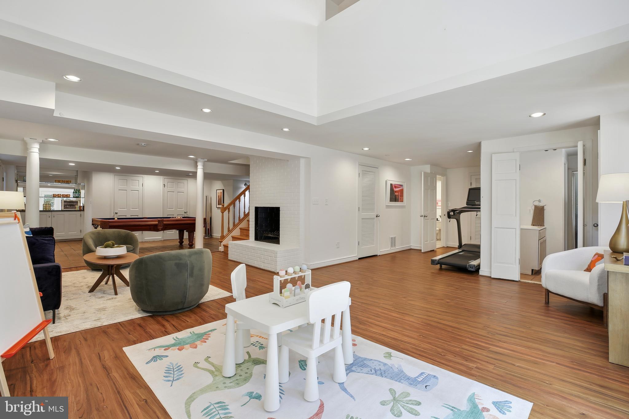 9914 Fernwood Road Bethesda, MD 20817 - Photo 46 of 61 a living room with furniture and a wooden floor