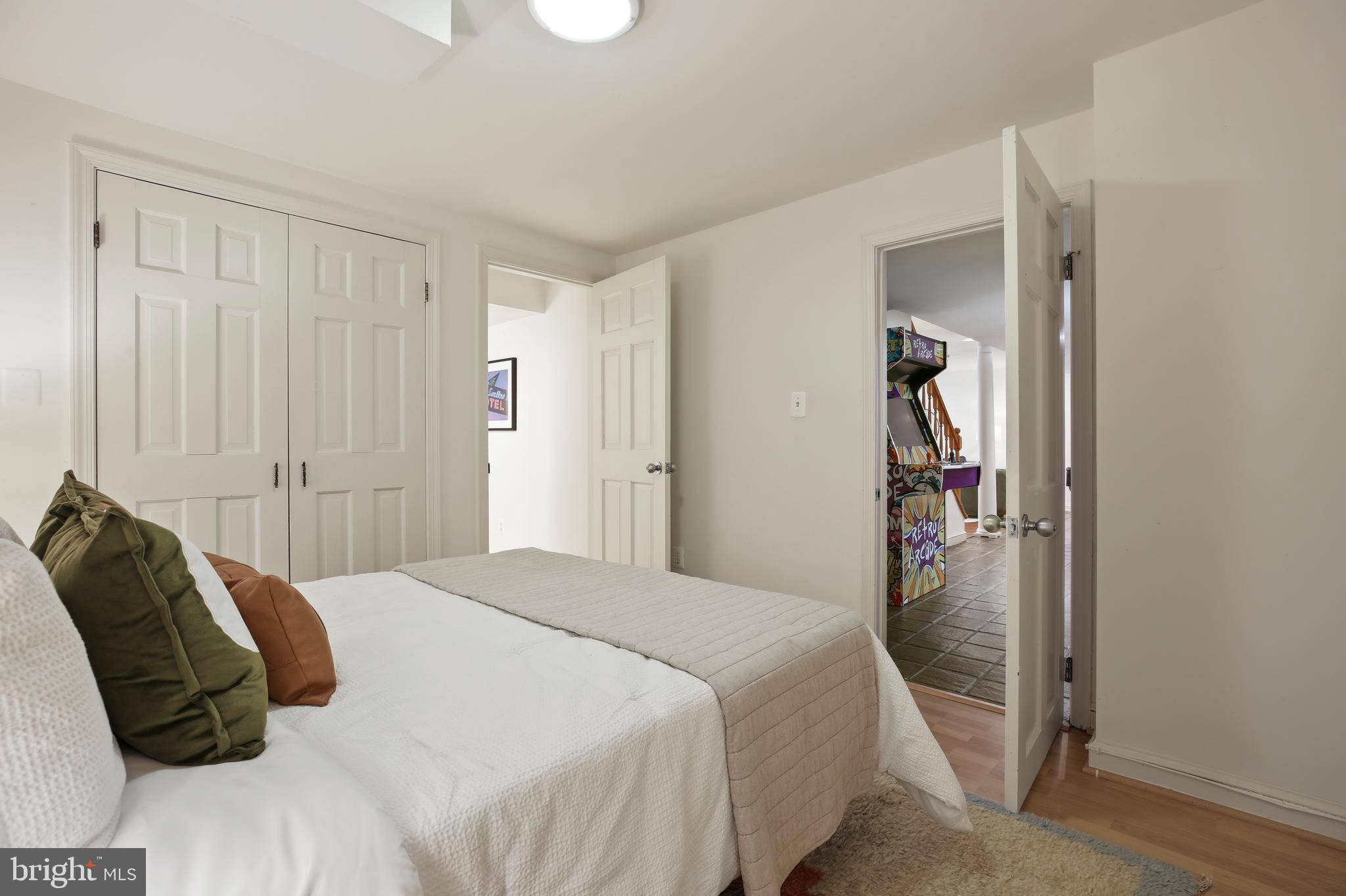 9914 Fernwood Road Bethesda, MD 20817 - Photo 51 of 61 a bedroom with a bed and a painting on the wall