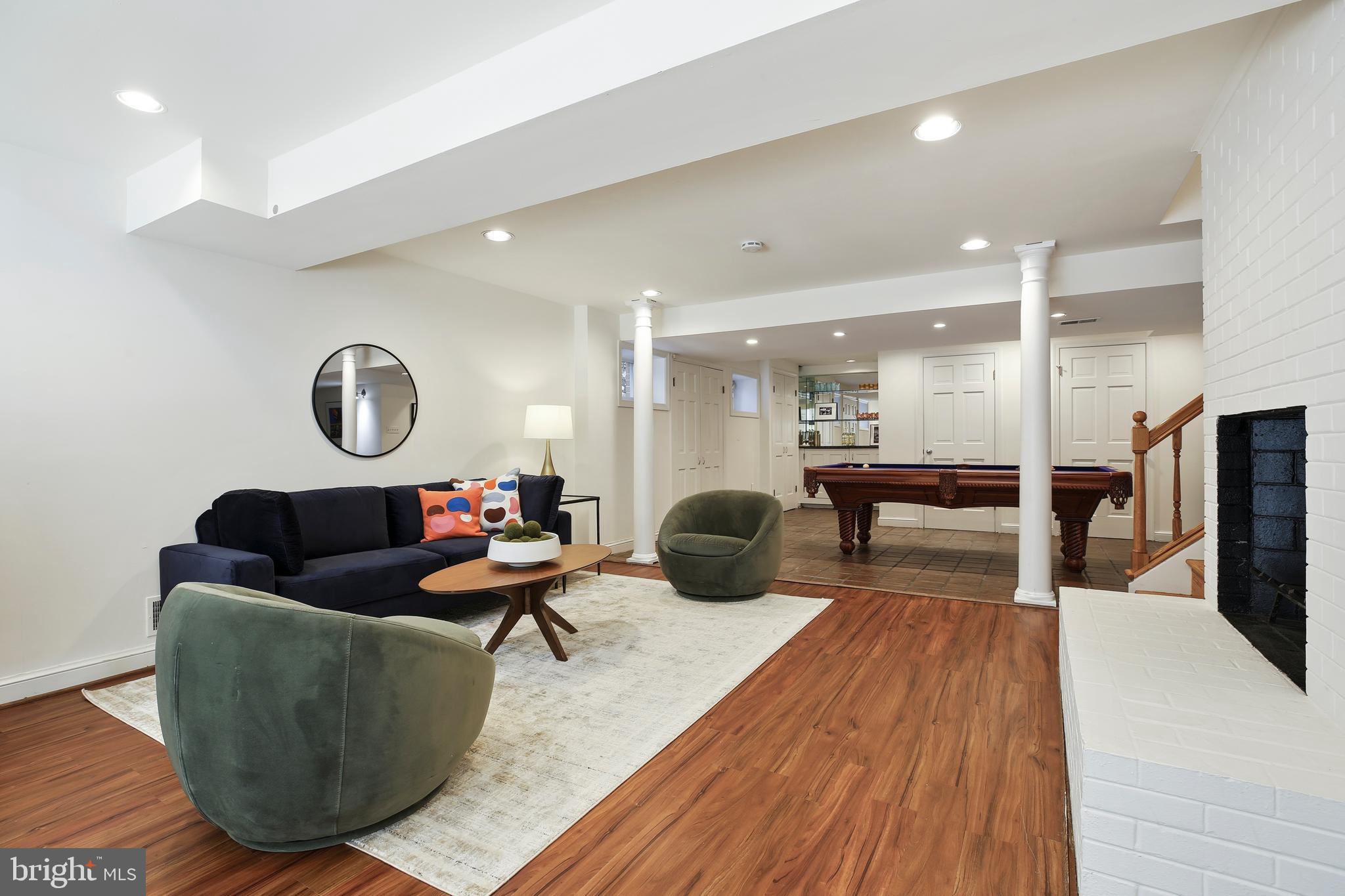 9914 Fernwood Road Bethesda, MD 20817 - Photo 54 of 61 a living room with furniture and a wooden floor