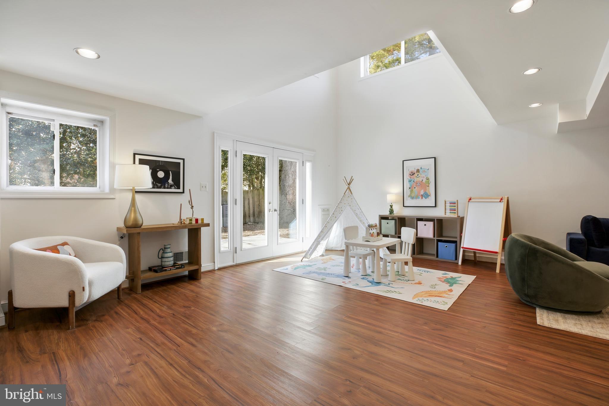 9914 Fernwood Road Bethesda, MD 20817 - Photo 55 of 61 a living room with furniture and a wooden floor