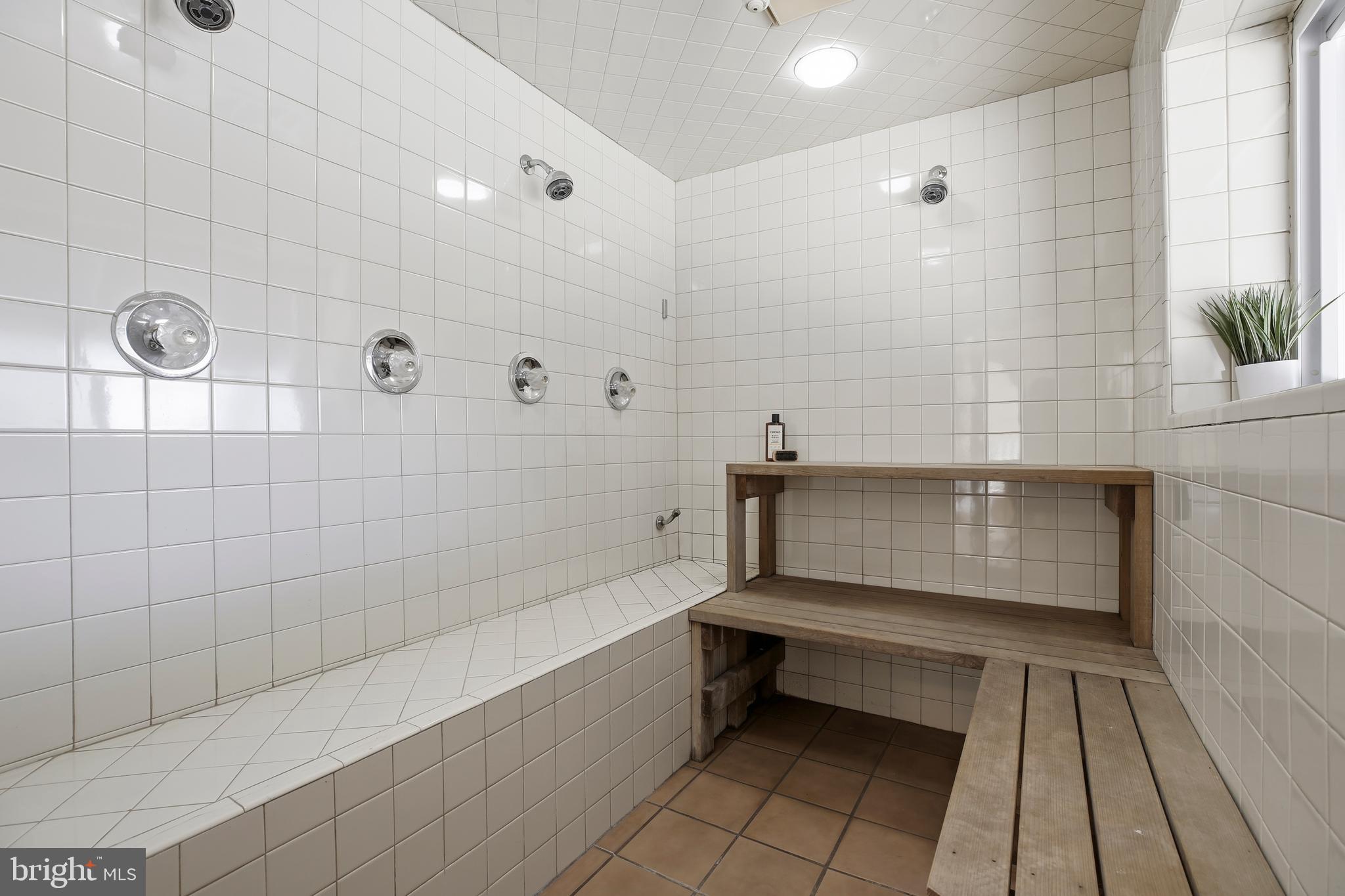 9914 Fernwood Road Bethesda, MD 20817 - Photo 58 of 61 a bathroom with a bathtub and shower