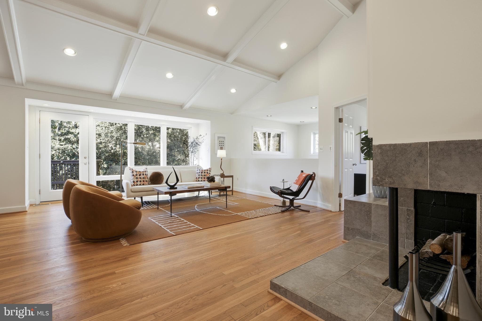 9914 Fernwood Road Bethesda, MD 20817 - Photo 6 of 61 a living room with furniture and a fireplace
