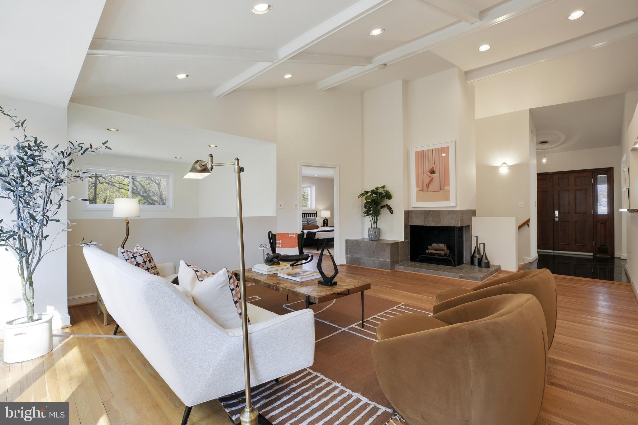 9914 Fernwood Road Bethesda, MD 20817 - Photo 9 of 61 a living room with furniture fireplace and a table