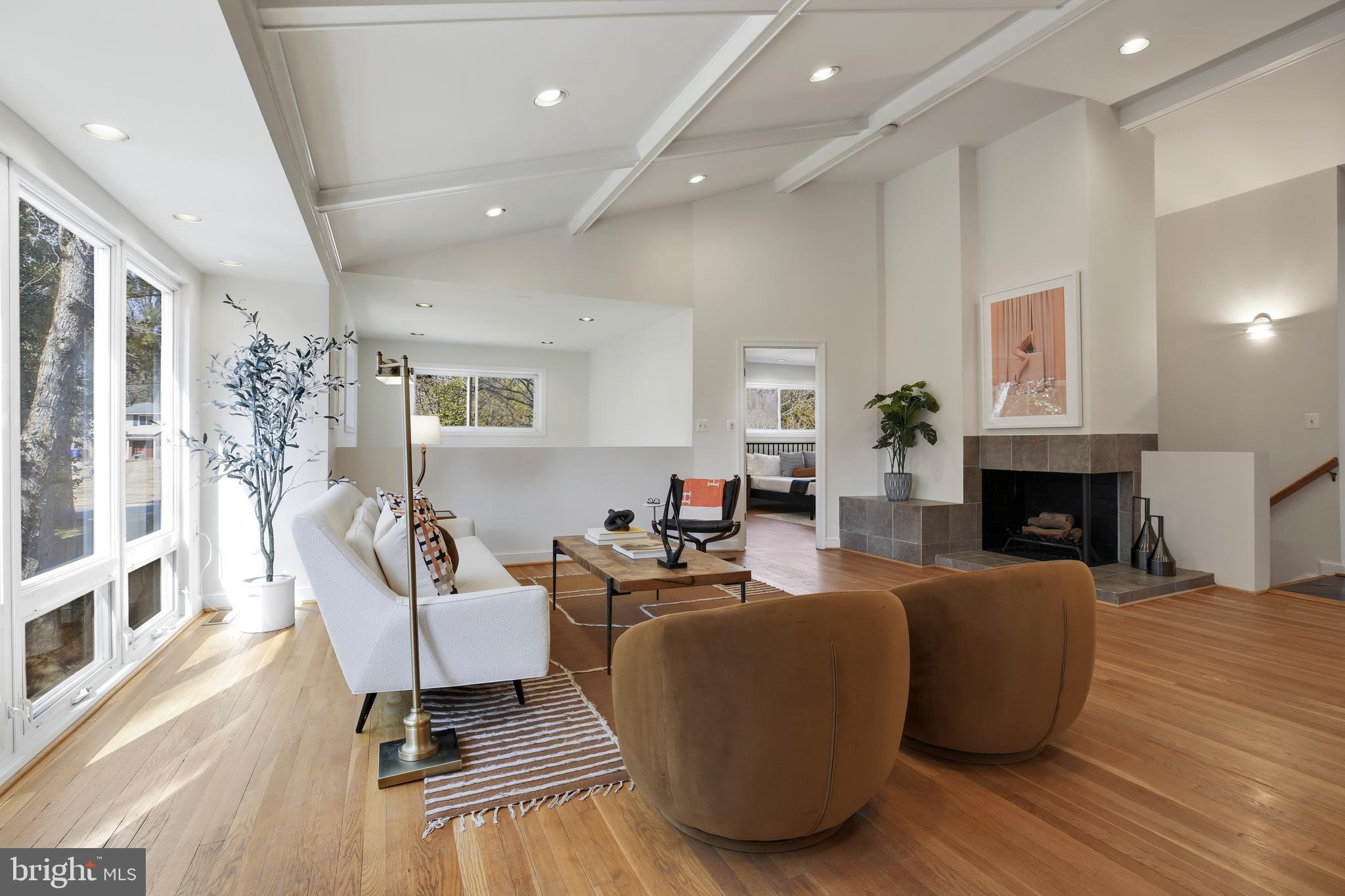 9914 Fernwood Road Bethesda, MD 20817 - Photo 10 of 61 a living room with fireplace furniture and a wooden floor