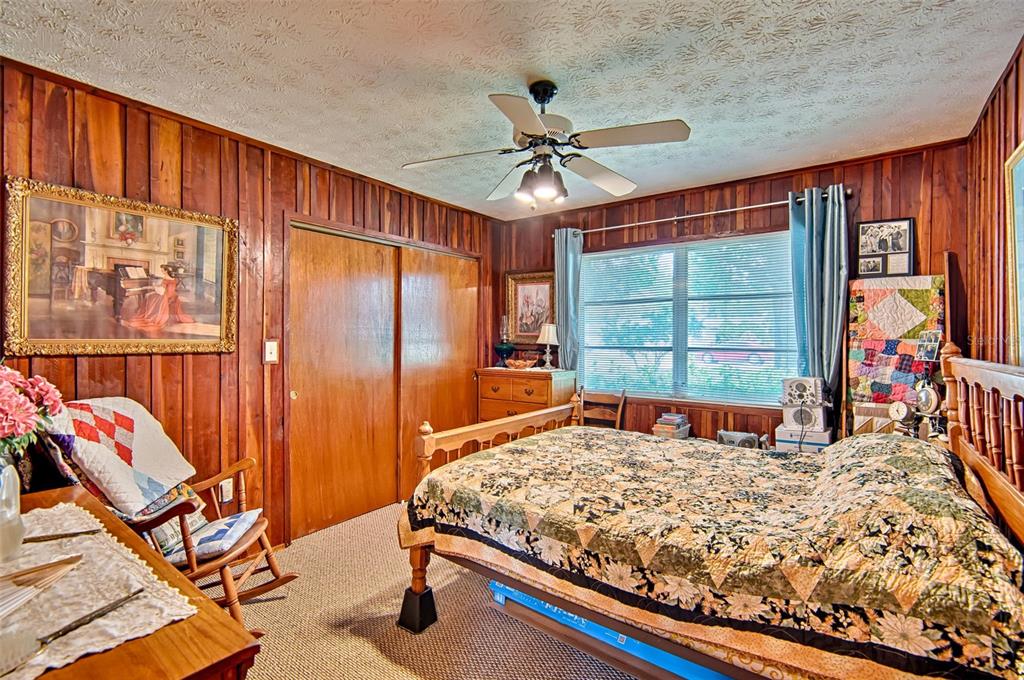 6537 Triest Avenue Keystone Heights, FL 32656 - Photo 22 of 36 a bedroom with a bed and a window