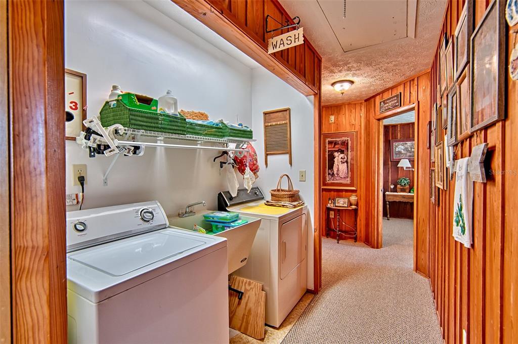 6537 Triest Avenue Keystone Heights, FL 32656 - Photo 23 of 36 a utility room with dryer and washer