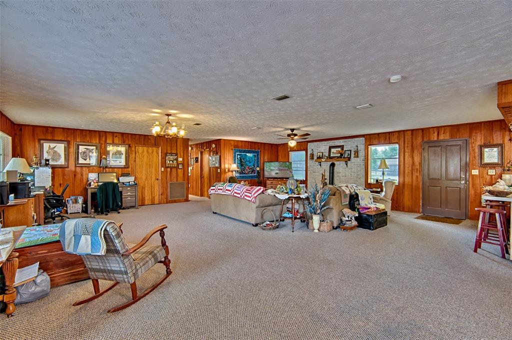6537 Triest Avenue Keystone Heights, FL 32656 - Photo 3 of 36 a view of a room with gym equipment